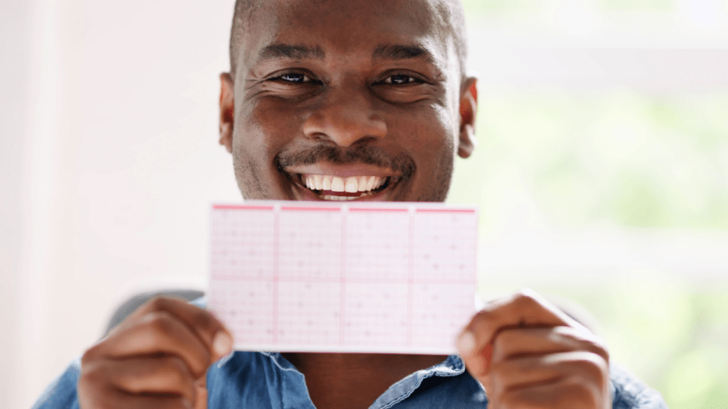 Man holding lottery ticket